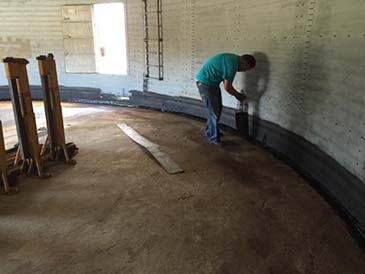 Worker Placing Hot Rubber Sealant